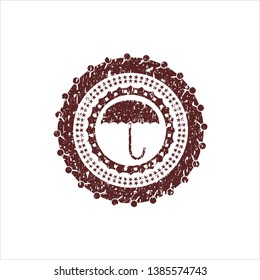 Red umbrella icon inside rubber grunge texture stamp
