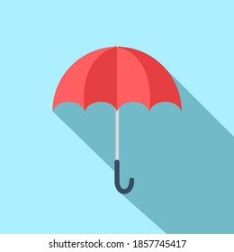 Red umbrella with long shadow isolate on blue background.