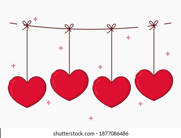 Red valentines hang on a rope. Heart symbol of love. Happy Valentine's Day.
