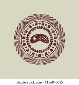 Red video game icon inside distressed rubber grunge texture seal