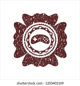 Red video game icon inside distressed grunge style stamp