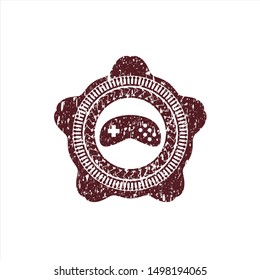 Red video game icon inside rubber texture