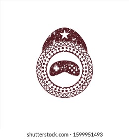 Red video game icon inside distress rubber grunge stamp