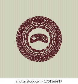Red video game icon inside rubber grunge texture stamp