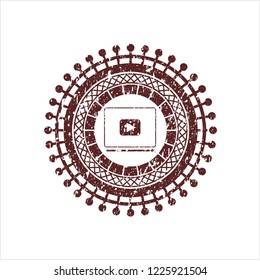 Red video player icon inside rubber grunge stamp