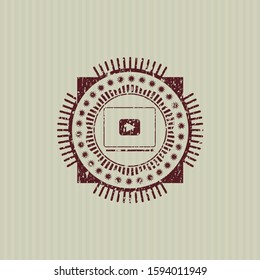 Red video player icon inside rubber grunge texture stamp