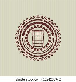 Red wastepaper basket icon inside distressed rubber stamp with grunge texture