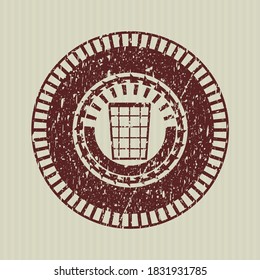 Red wastepaper basket icon inside grunge style stamp. 