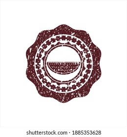 Red watermelon icon inside distressed rubber stamp. 