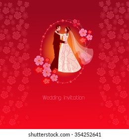 Red wedding invitation with spring flowers of sakura. The bride and groom in a frame decorated  branches sakura flowers.