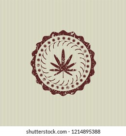 Red weed leaf icon inside distressed rubber texture