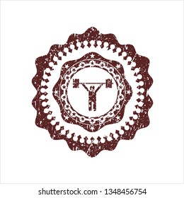 Red weightlifting icon inside distressed rubber texture