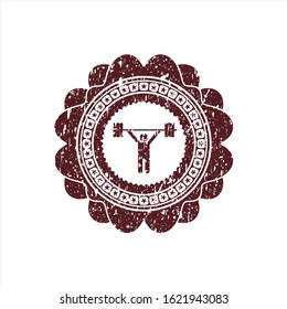 Red weightlifting icon inside distressed grunge stamp