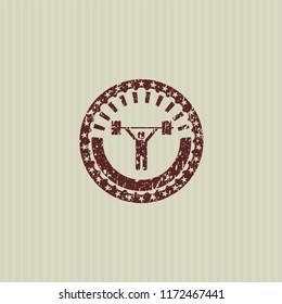 Red weightlifting icon inside rubber grunge texture stamp