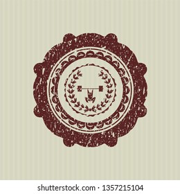Red weightlifting inside of crown icon inside rubber grunge texture seal