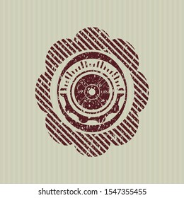 Red weightlifting or powerlifting plate (45 lbs) icon inside distress rubber grunge stamp