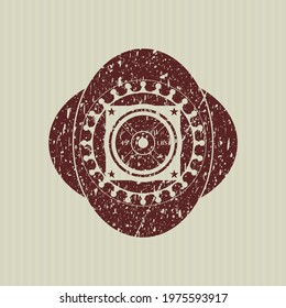 Red weightlifting or powerlifting plate (45 lbs) icon inside distress rubber stamp with grunge texture. 