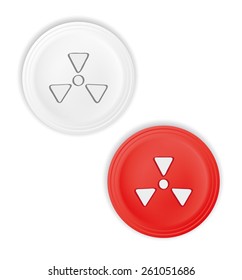 red and white buttons with radioactive symbol