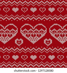 Red and white knitted background with hearts. Knitted pattern on a red background. Ornament. Valentine's Day background. Sweater texture hearts