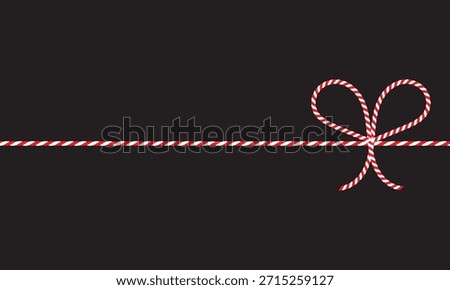 Red and White String Rope with Crossed Bow Isolated on black background. symbolizing gift wrapping, holidays, celebration, and handmade packaging on black  background.