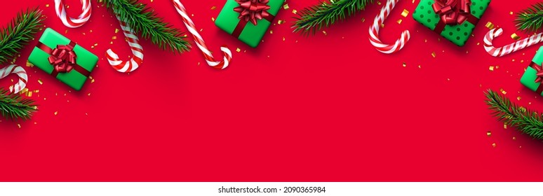Red and white striped candy cane sticks with fir branches and gift boxes. Red background. Space for text. Vector illustration.