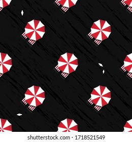 Red and white umbrellas and deck chairs at the black sand, aerial view. Vector seamless pattern