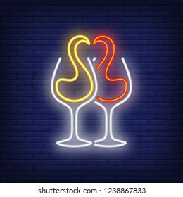 Red and white wine splashes in glasses neon sign. Winery or advertisement design. Night bright neon sign, colorful billboard, light banner. Vector illustration in neon style.