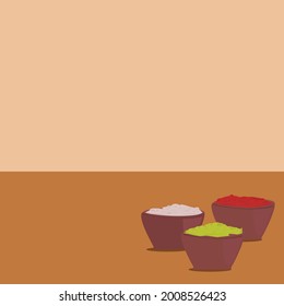 red and white yellow holi powder in bowls on wooden table