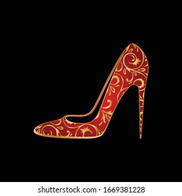 red woman's shoe with golden ornament