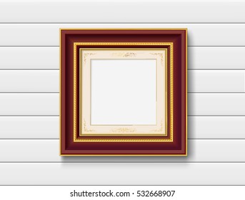 red wood picture frame on white wood wall