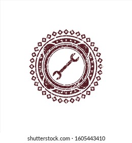 Red wrench icon inside grunge seal