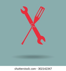 Red wrench and screwdriver icon 