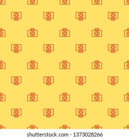 Red and yellow seamless pattern First aid kit icon. Health, help and medical diagnostics concept.
