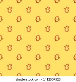 Red and yellow seamless pattern Headphone vector icon