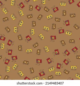 Altavoces rojo y amarillo con fondo marrón. Patrón sin foco. Para textiles, papel de embalaje, fondo u otro diseño.
