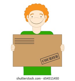 The red-haired cute courier is holding a parcel in his hands. Delivery
