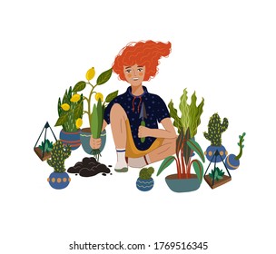 The red-haired guy sits with a shovel for gardening in his left hand, and in his right he has a plant for planting. He sits holding one leg under himself among the plants that he will probably plant.