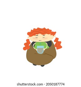 Redhead girl drinking coffee in a blanket