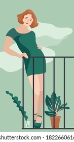 
Redhead girl in a green dress on the balcony of the house.
Stay home. Garden on the balcony.