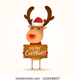 The red-nosed reindeer holds a wooden board with Christmas greetings. Isolated. 