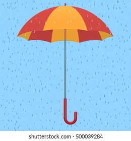 red-yellow umbrella against the background of a rain
