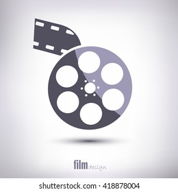 Reel of film is linear. With tape and shadow. On a gray background.   