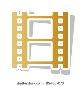 Reel of film sign. Vector. Golden gradient icon with white contour and rotated gray shadow at white background.