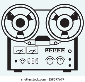 Reel tape recorder isolated on blue background