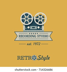 Reel to reel tape recorder. Vector logo. The emblem in retro style. Recording Studio.