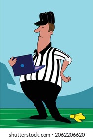  A referee looks at a laptop after dropping a flag.