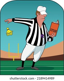 A referee looks over the rule book.