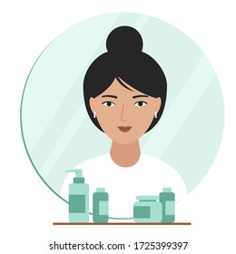 Reflection of a girl in the mirror. Interior elements in the bathroom: mirror, shelf, jars with cosmetics. 