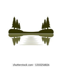 reflections of pine trees at the bank of a lake 