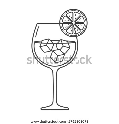 Refreshing gin and tonic cocktail with ice cubes and lime slice in a wine glass